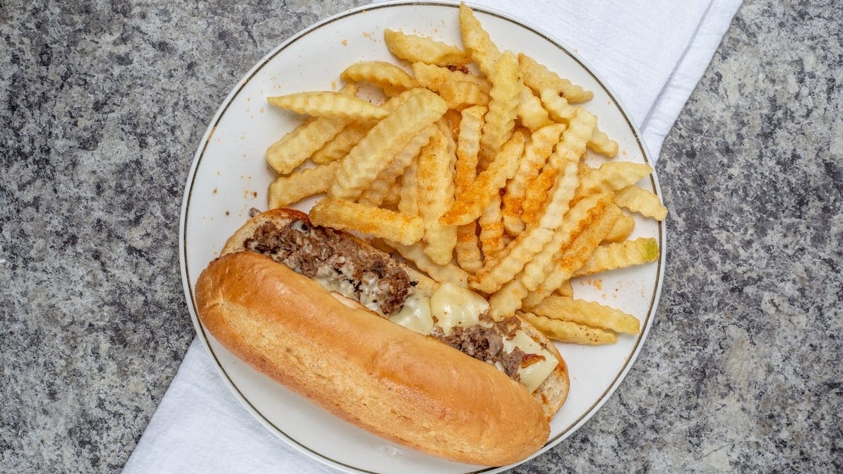 Philly Cheese Steak Sandwich with Fries.